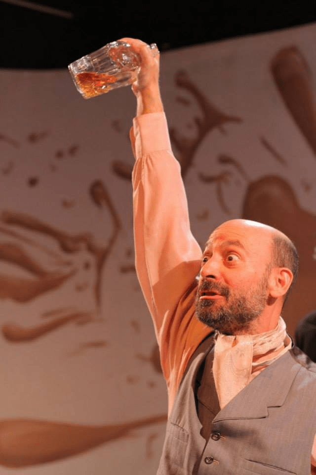 Jeff Blumberg as the character of Rudolph in the play 99 Ways to Fuck a Swan