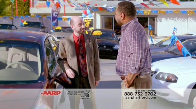 Actor Jeff Blumberg playing a used car salesman in a TV commercial